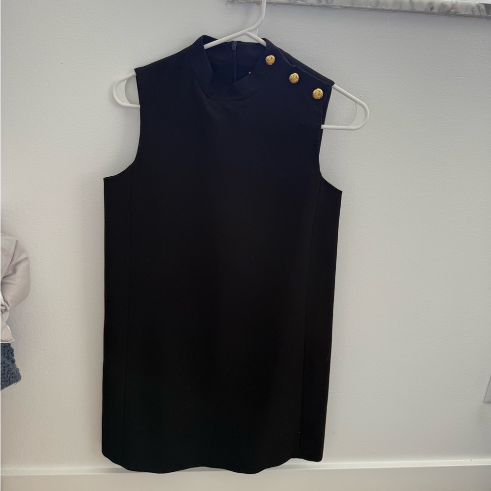 black mini dress with gold buttons